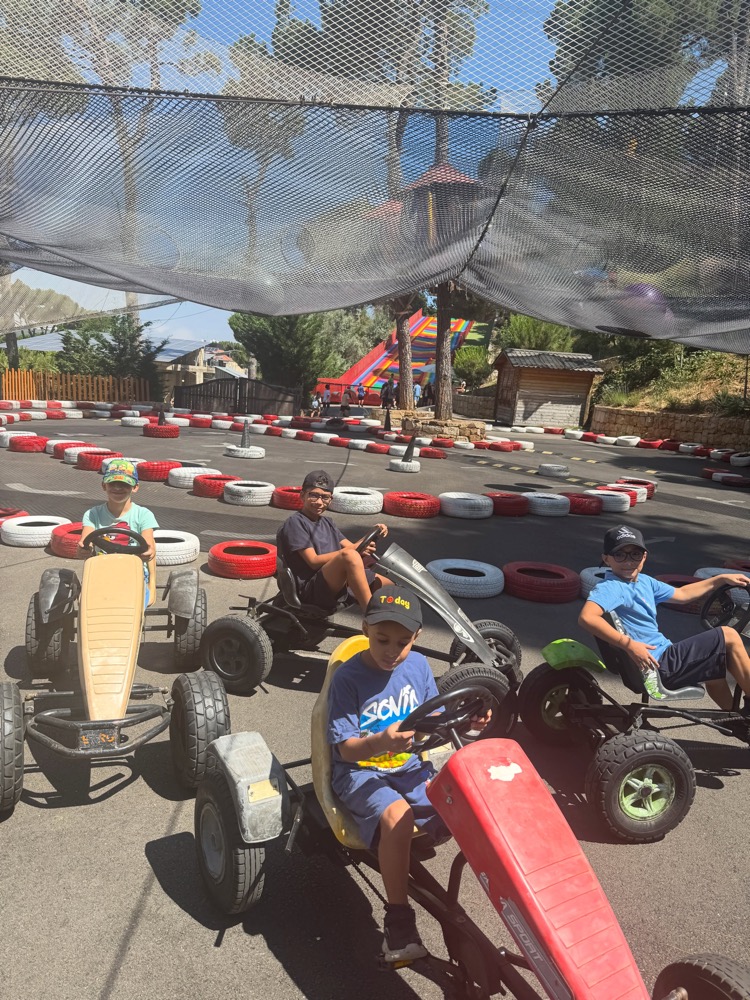 Children on pedal go-karts during a Libami outing