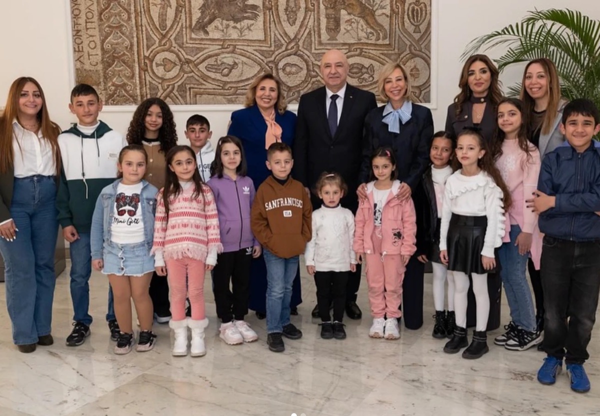 Group photo of Libami's team and children at the March 2025 reception